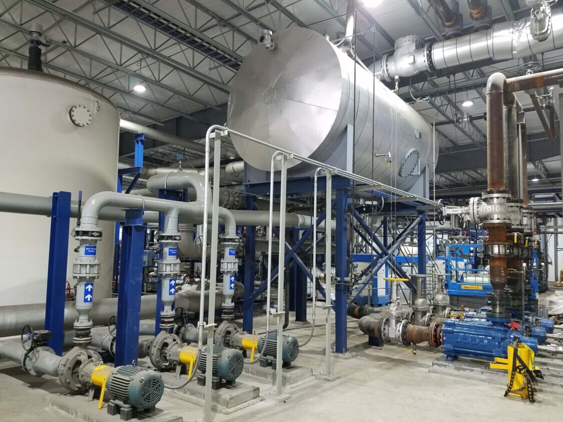 Industrial wastewater treatment system with an elevated tank and connected pipes