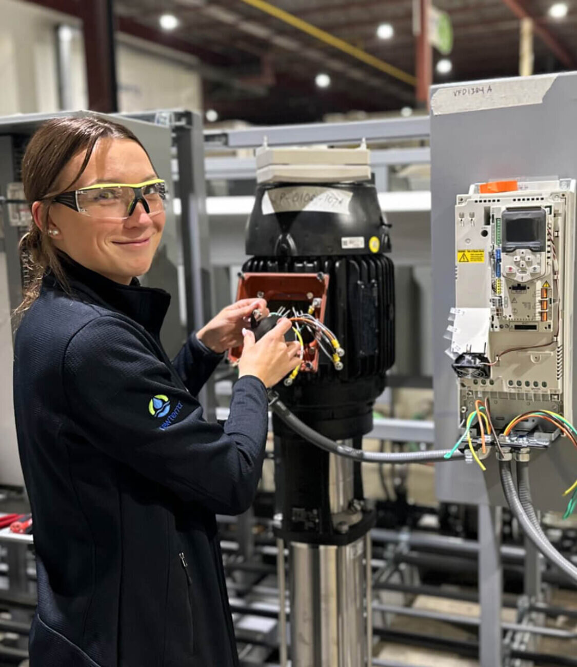 Technician working on wiring of water treatment equipment